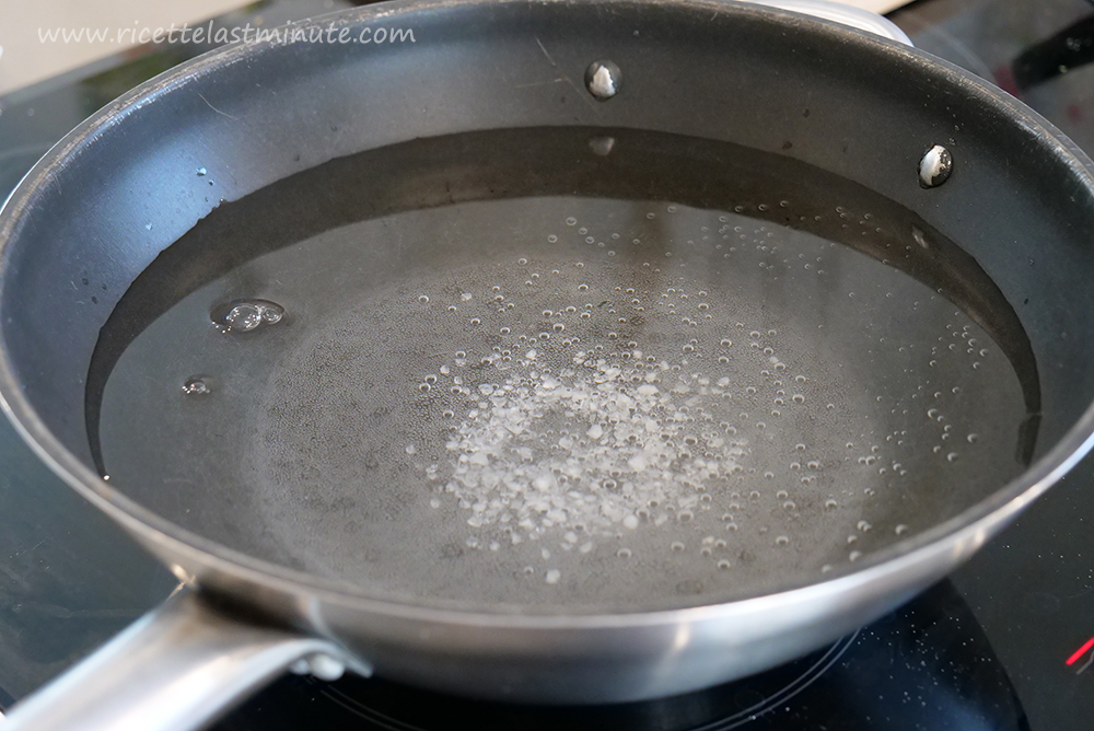 Wok with water and coarse salt