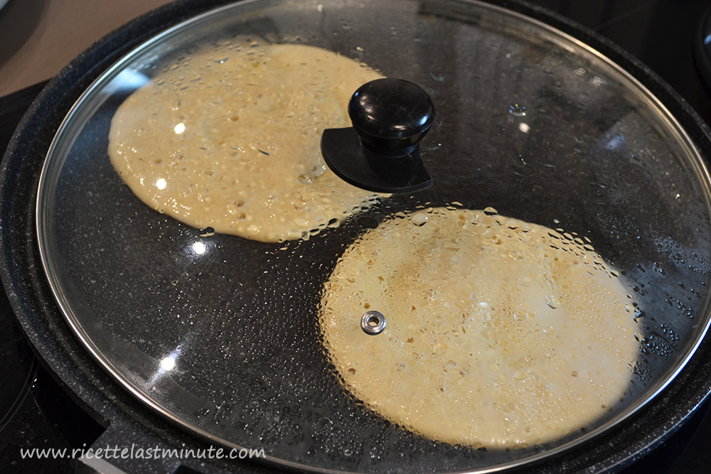 Banana pancakes being cooked on a hot plate
