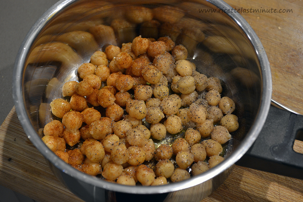 Precooked Chickpeas in a pan with paprika and pepper