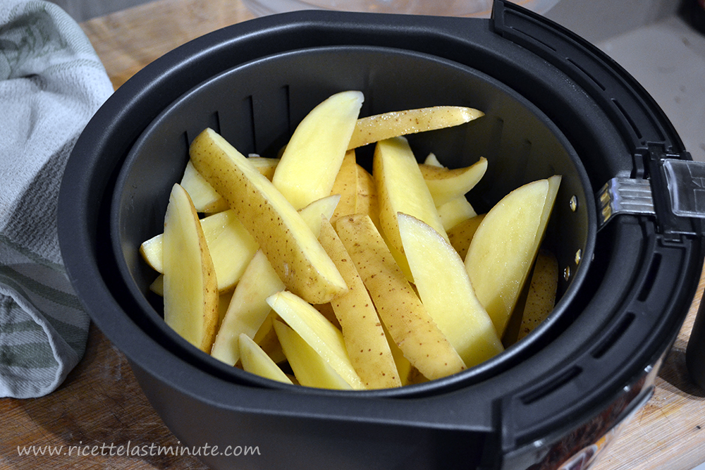 Potatoes seasoned with a spoonful of oil and put in the air fryer basket